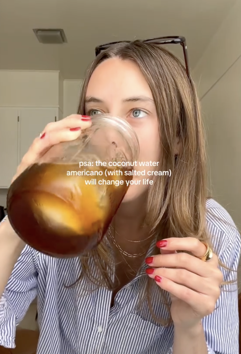 woman drinking a cup of coffee